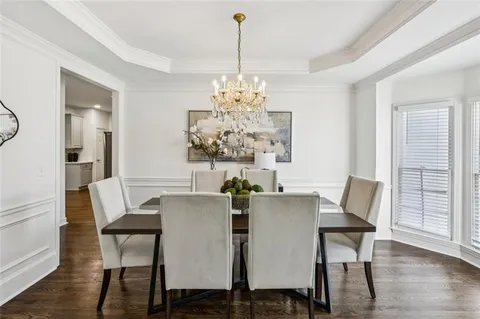 a bedroom with a bed a couch and potted plant with the outer view