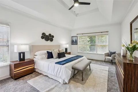 a living room with furniture and a chair