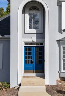 a view of entryway with wooden floor