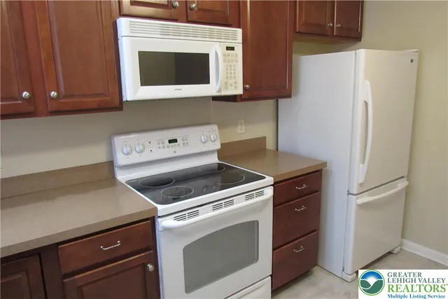 a kitchen with a stove and a microwave