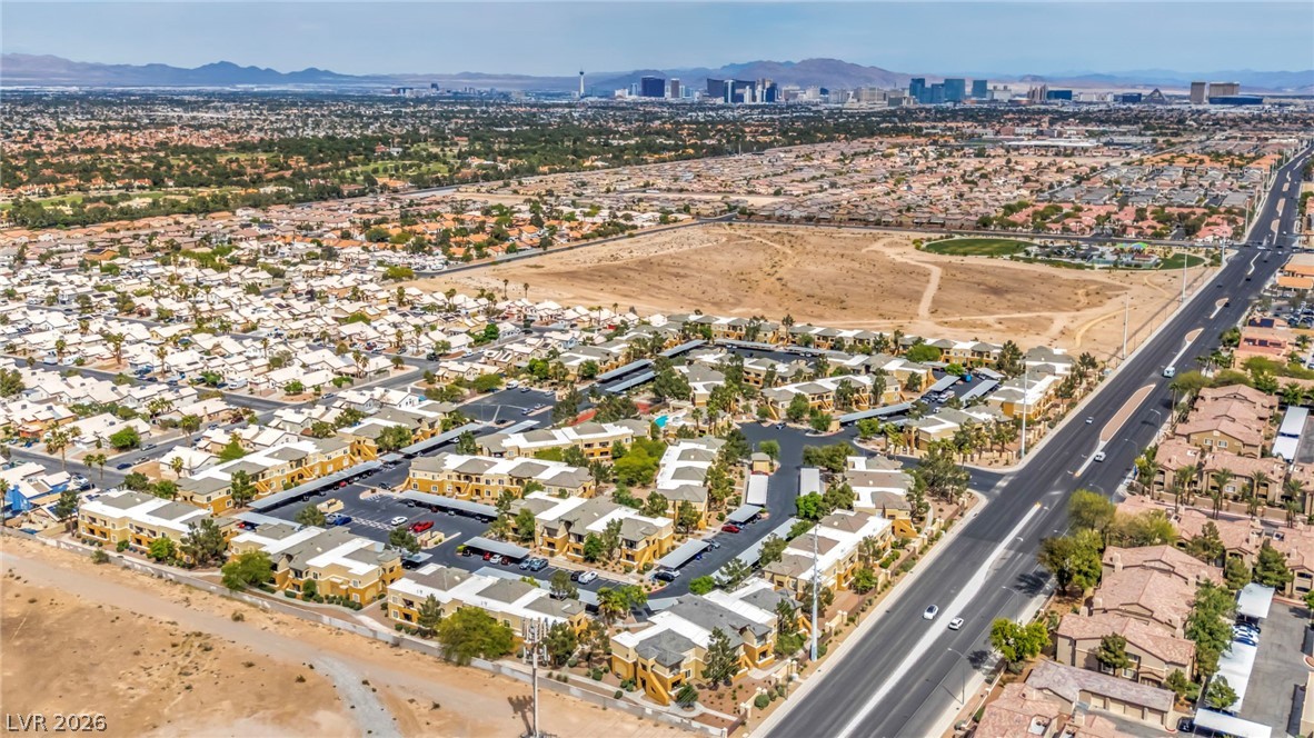 8070 West Russell Road, Unit 2060 Las Vegas, NV 89113 - Photo 39 of 47 This elevated view captures a sprawling community with distant urban skylines and natural landscapes.