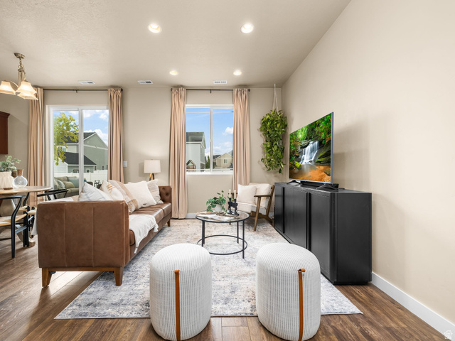 834 West 1050th Street South Springville, UT 84663 - Photo 3 of 26 Open-concept living area featuring wood-finish flooring, recessed lighting, and ample natural light from multiple windows