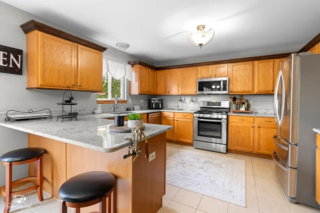 a kitchen with a sink cabinets and window