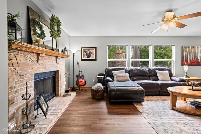 a living room with furniture and a fireplace