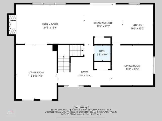 a view of hallway with wooden floor and stairs