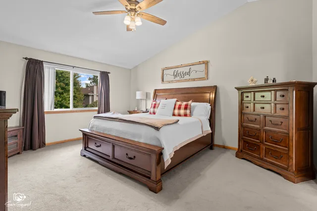 a view of walk in closet with clothes