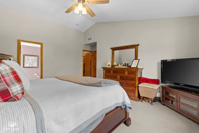 a spacious bathroom with a double vanity sink and a mirror