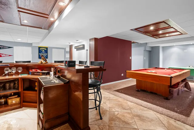 a view of a dining room with furniture and a kitchen