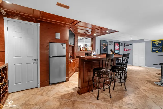 a living room with furniture and a ceiling fan