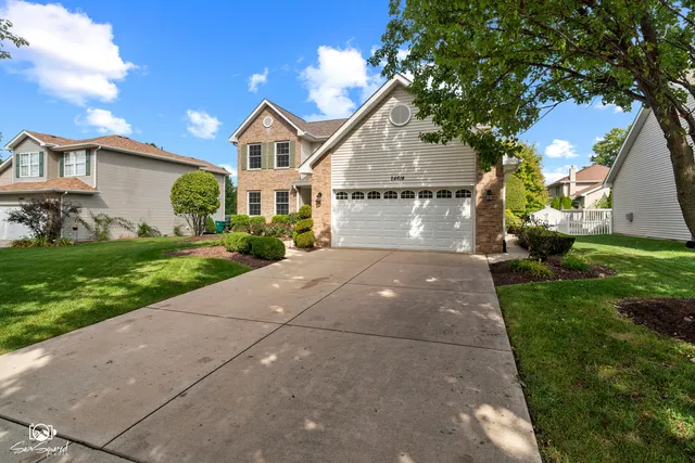 an aerial view of a house with yard swimming pool and outdoor seating