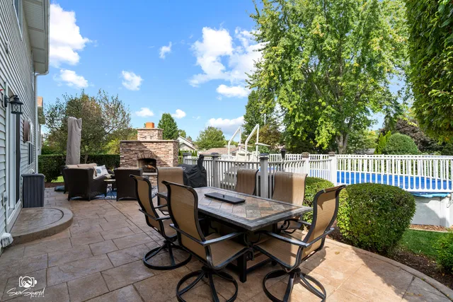 a view of a dinning tables and chairs in the patio