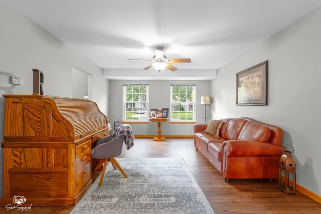 a living room with furniture and a potted plant