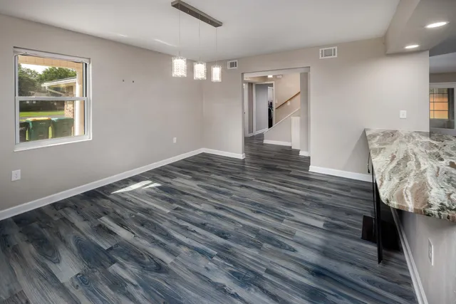 a view of livingroom and hardwood floor
