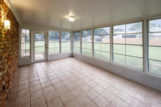 a view of an empty room and window