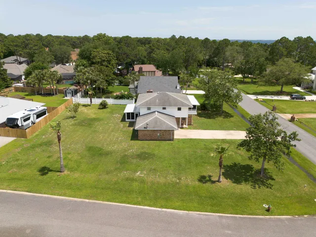 a swimming pool with some trees in the background