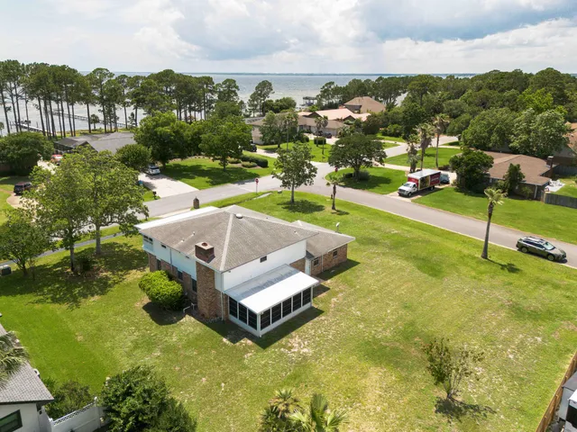 a aerial view of a house with a yard