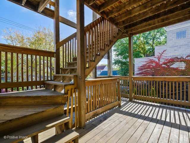 a view of balcony with wooden floor