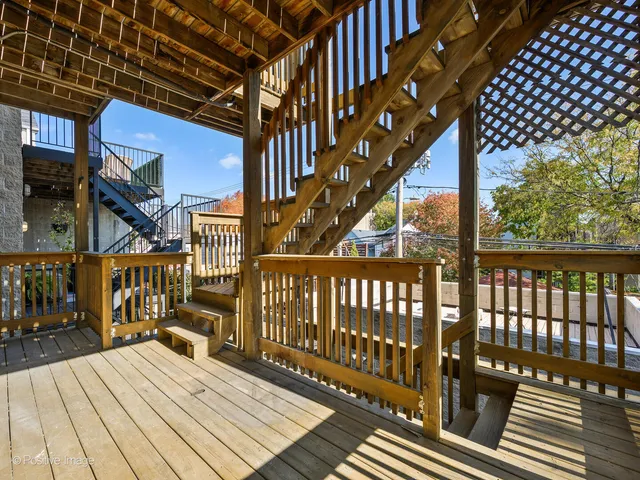 a view of deck with wooden floor and bench