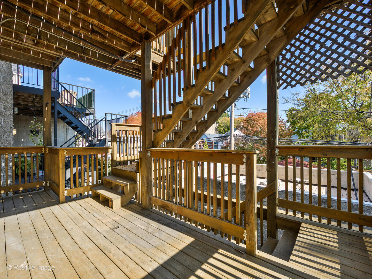 3033 North Racine Avenue, Unit 2 Chicago, IL 60657 - Photo 19 of 20 a view of deck with wooden floor and bench
