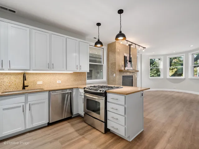 a kitchen with a stove and a sink