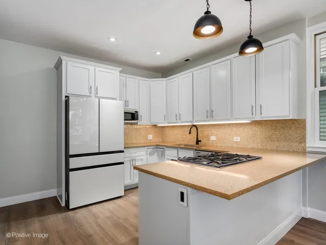 a kitchen with appliances and cabinets