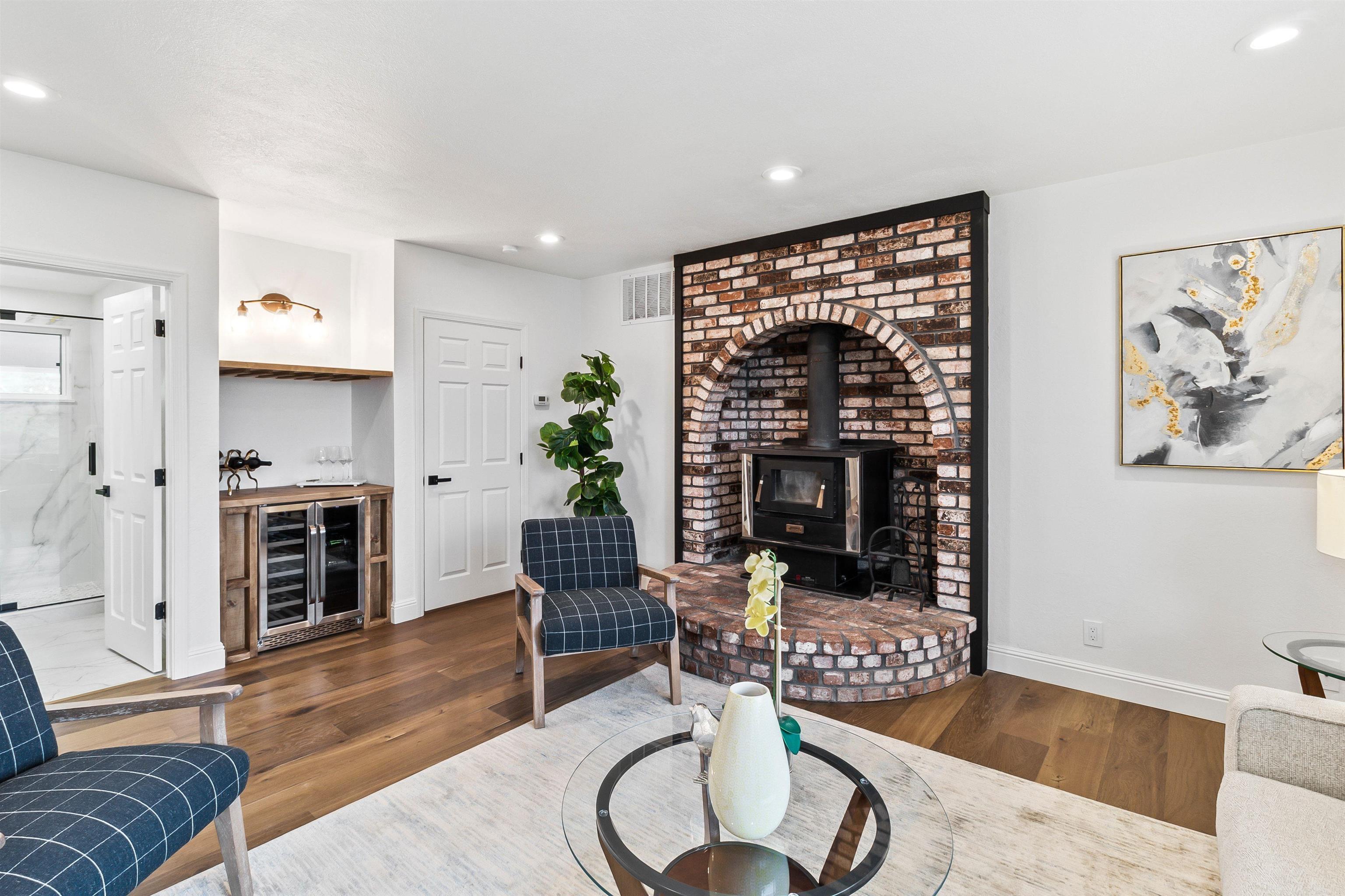 12200 Tesla Road Livermore, CA 94550 - Photo 16 of 60 a living room with furniture and a fireplace