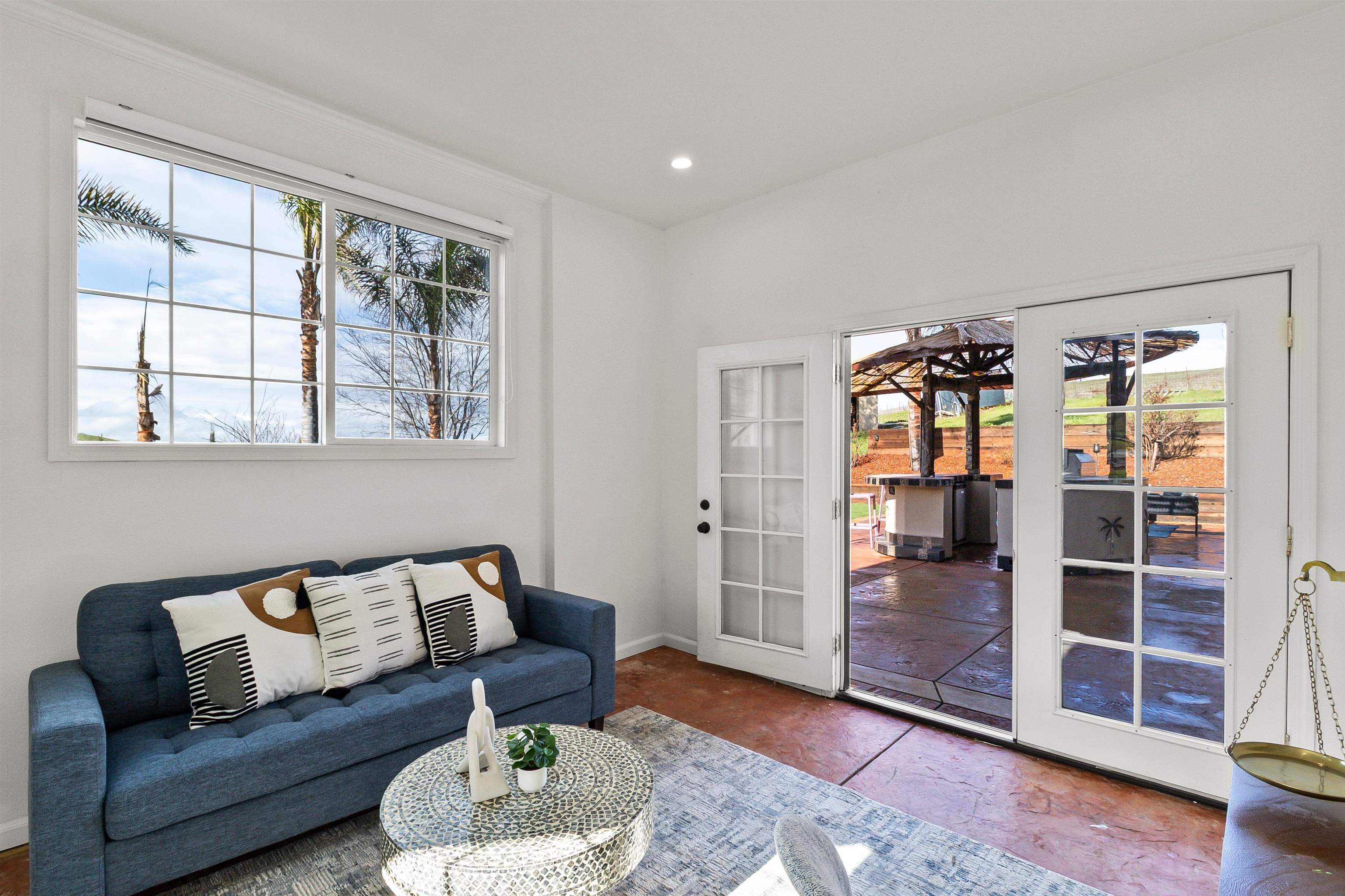 12200 Tesla Road Livermore, CA 94550 - Photo 19 of 60 a living room with furniture and a window
