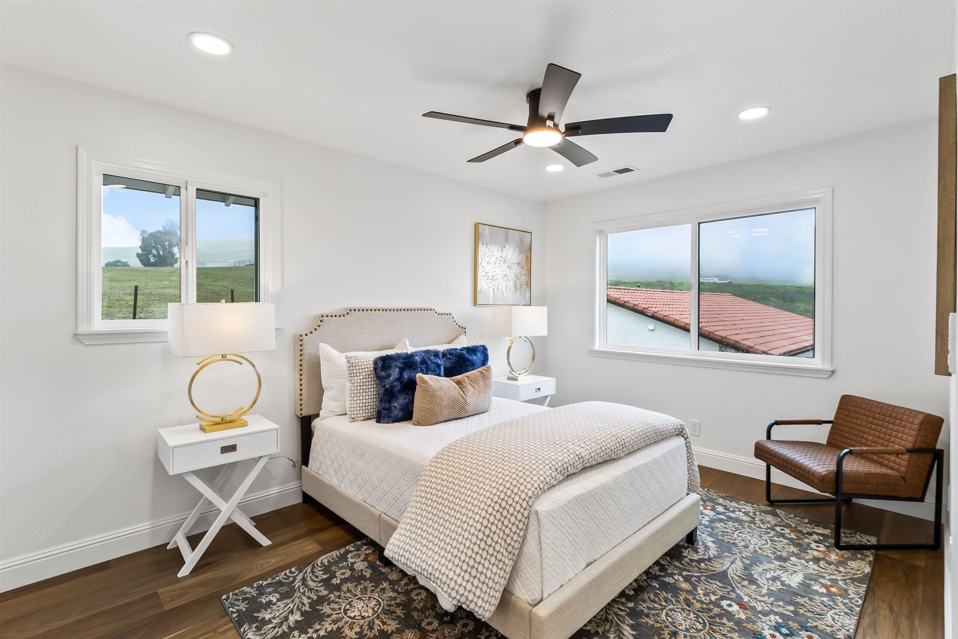 12200 Tesla Road Livermore, CA 94550 - Photo 33 of 60 a bedroom with a bed a desk and chair