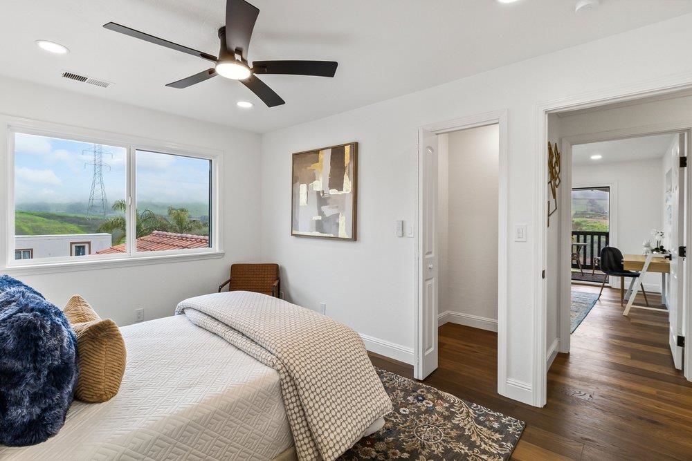 12200 Tesla Road Livermore, CA 94550 - Photo 34 of 60 a bedroom with a large bed and a window