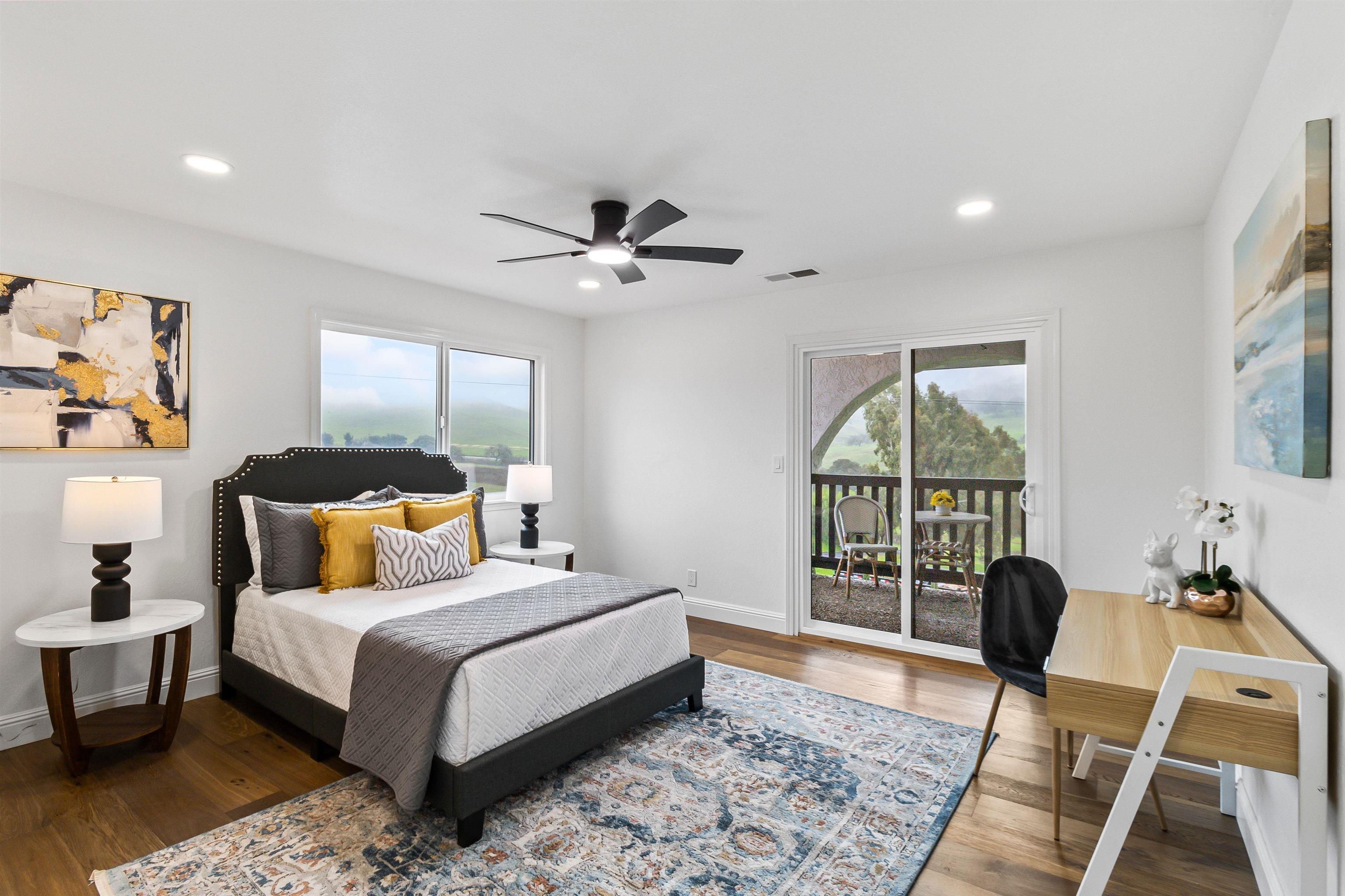 12200 Tesla Road Livermore, CA 94550 - Photo 35 of 60 a bedroom with a bed a chandelier and a window