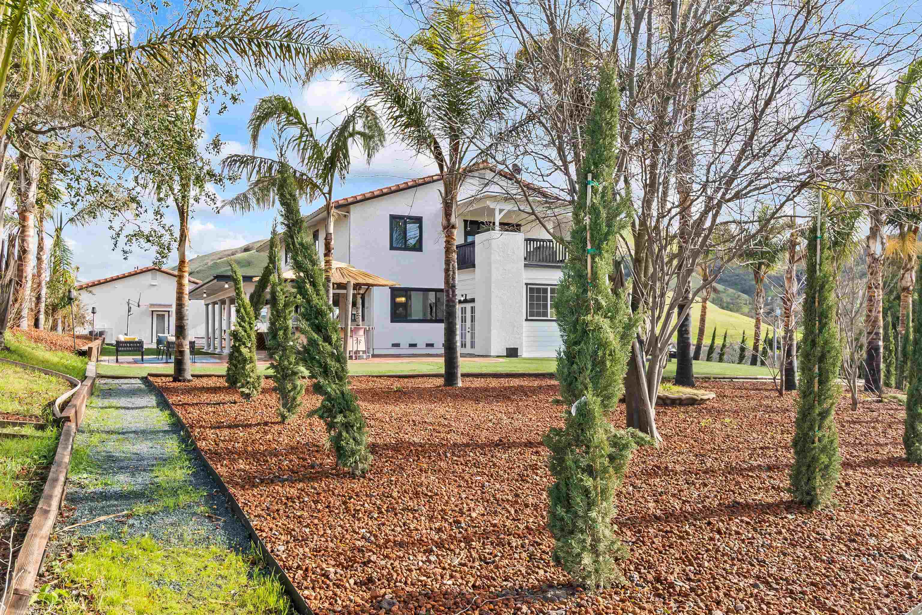 12200 Tesla Road Livermore, CA 94550 - Photo 41 of 60 a front view of a house with a yard