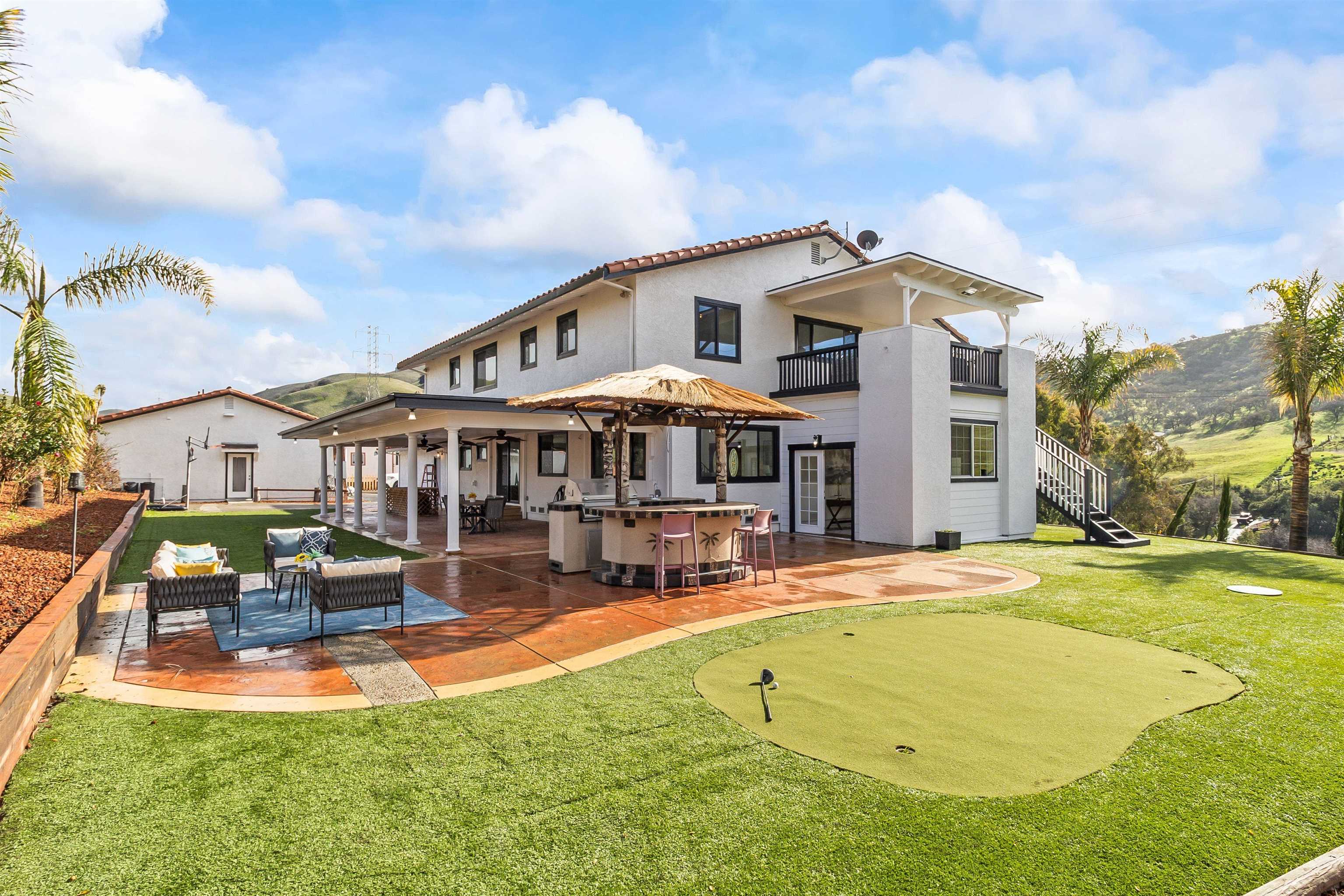 12200 Tesla Road Livermore, CA 94550 - Photo 48 of 60 a front view of house with yard and swimming pool