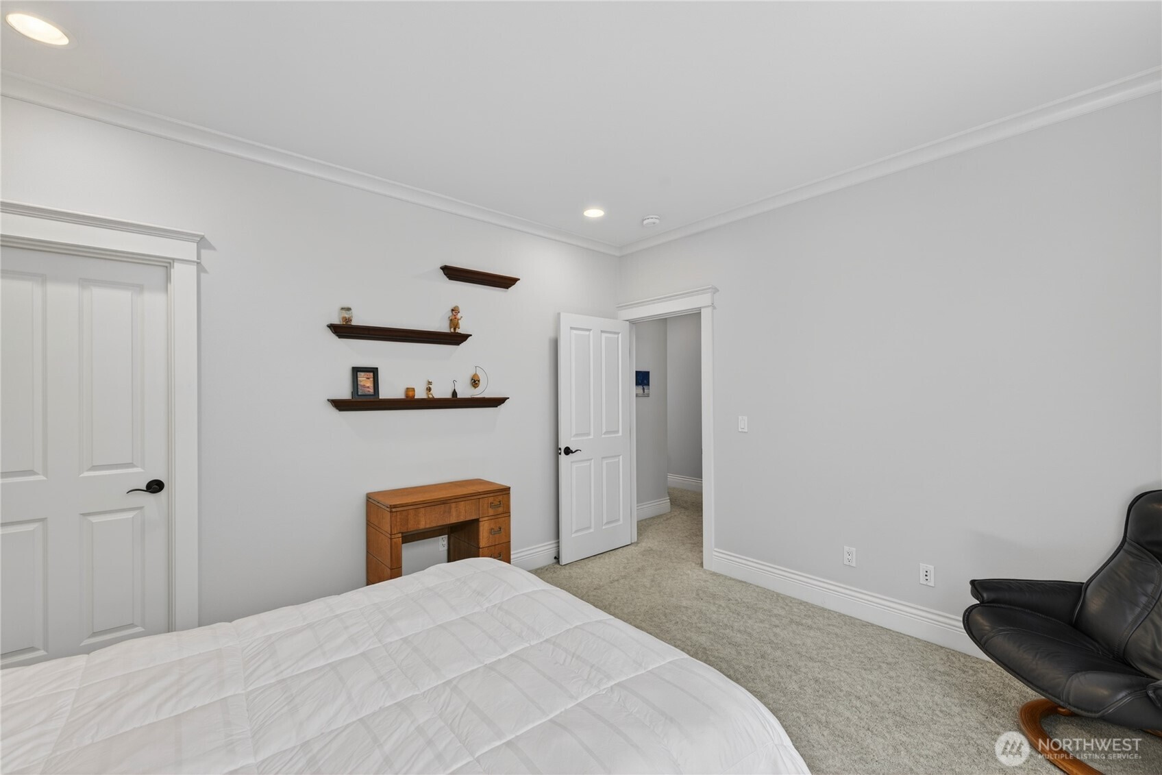 1908 29th Place Anacortes, WA 98221 - Photo 24 of 40 a bedroom with a bed and a chair