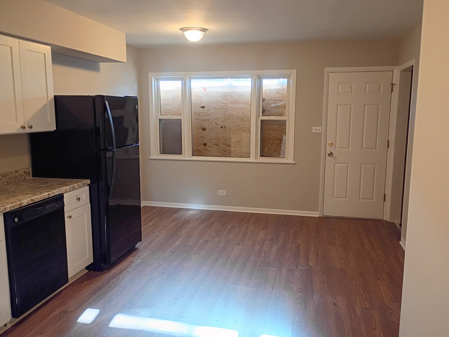 4245 West 78th Street Chicago, IL 60652 - Photo 12 of 21 a view of a kitchen with wooden floor and electronic appliances