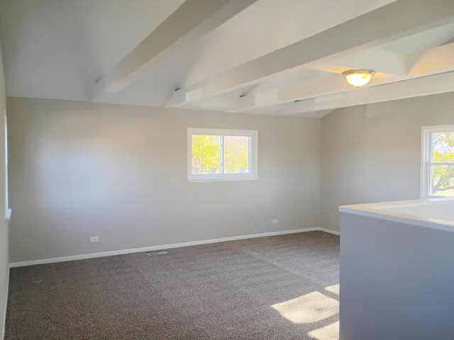 a view of a room that has a window in it