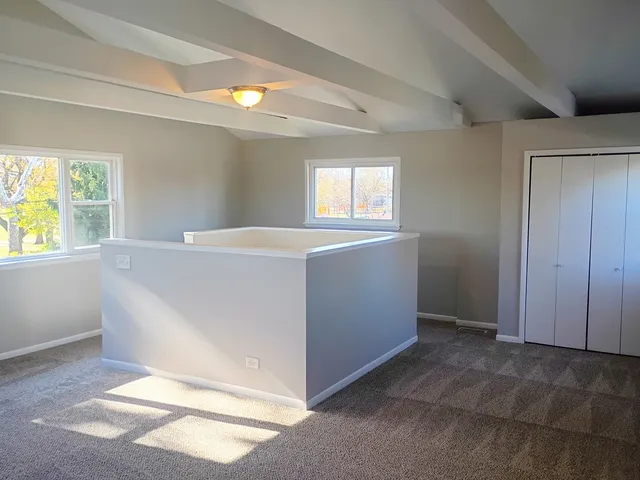 a view of an empty room and window