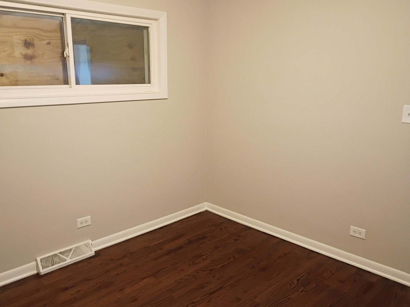 4245 West 78th Street Chicago, IL 60652 - Photo 6 of 21 a view of a small space with wooden floor and a window
