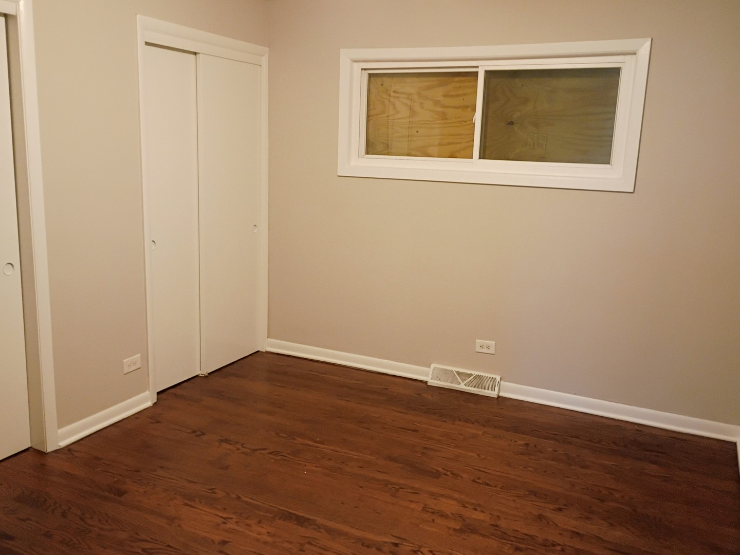 4245 West 78th Street Chicago, IL 60652 - Photo 7 of 21 an empty room with wooden floor and windows