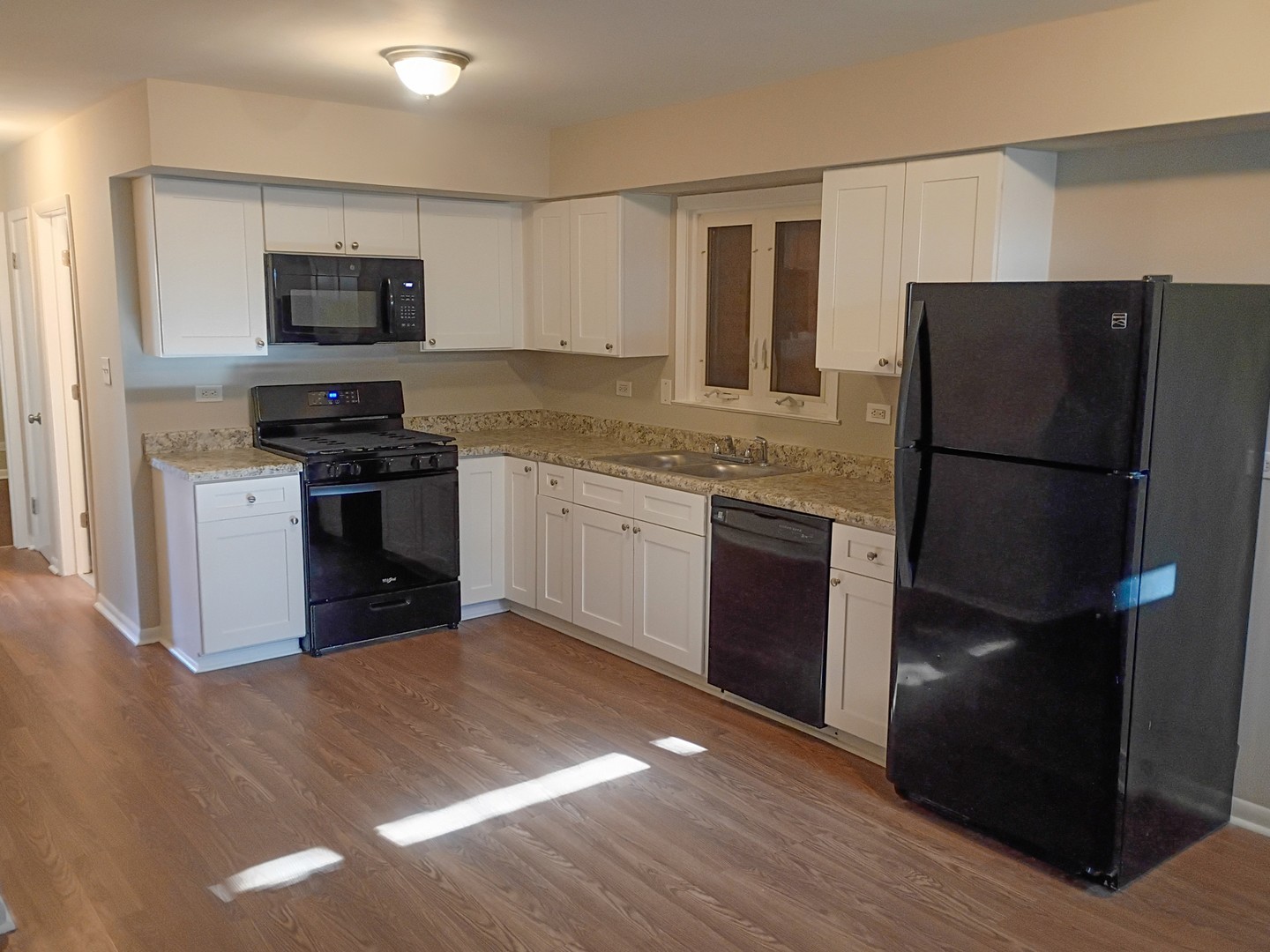 4245 West 78th Street Chicago, IL 60652 - Photo 10 of 21 a kitchen with a refrigerator stove and microwave
