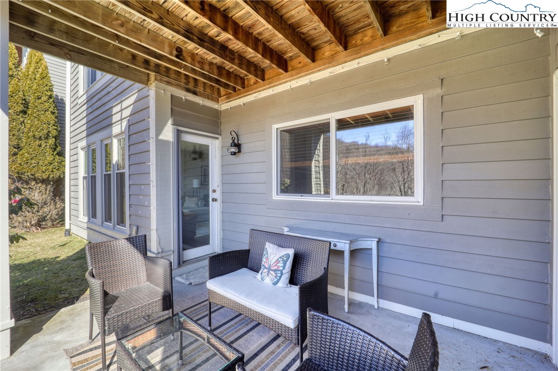 1355 7 Devils Road, Unit 302 Seven Devils, NC 28604 - Photo 37 of 44 a front view of a house with outdoor seating