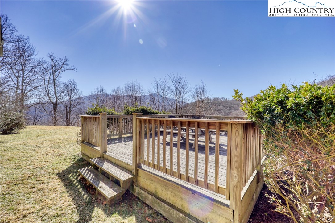 1355 7 Devils Road, Unit 302 Seven Devils, NC 28604 - Photo 41 of 44 a view of a roof deck with wooden fence and floor