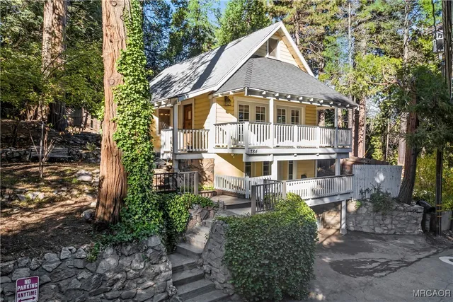 a aerial view of a house with a yard