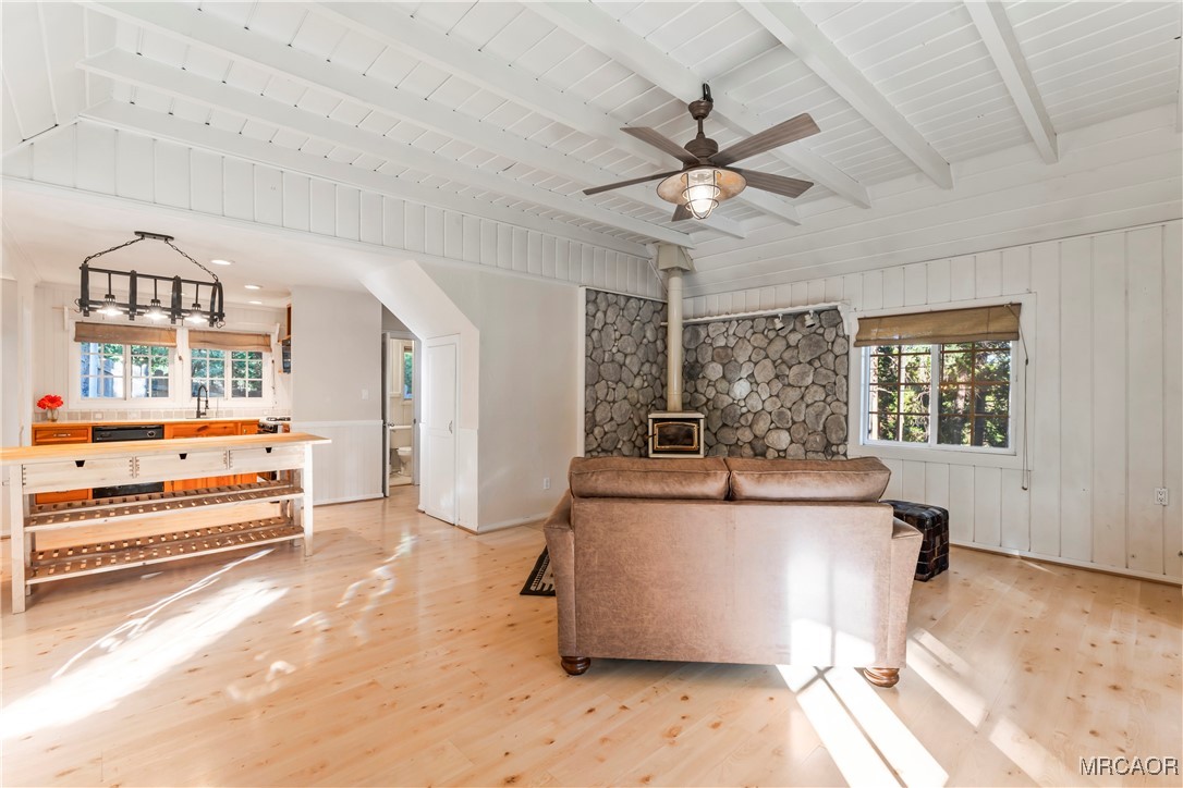 784 Sierra Vista Drive Twin Peaks, CA 92391 - Photo 3 of 17 a room with a chandelier and a wooden floor