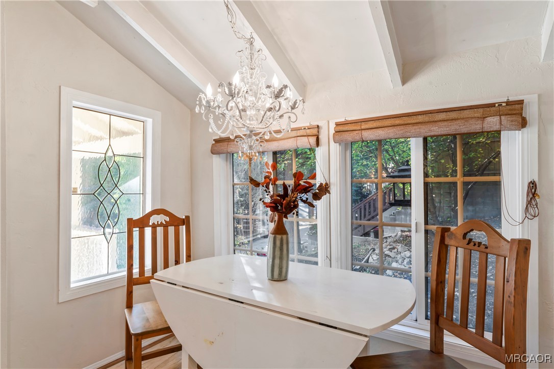 784 Sierra Vista Drive Twin Peaks, CA 92391 - Photo 6 of 17 a view of a dining room with furniture window and outside view