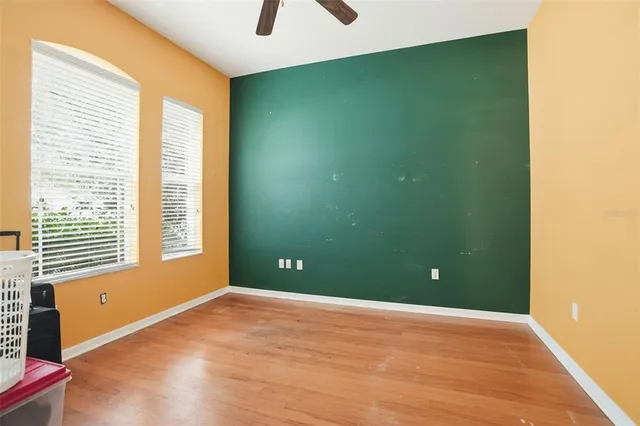 wooden floor and window in an empty room