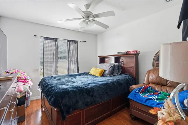 a bedroom with bed and windows