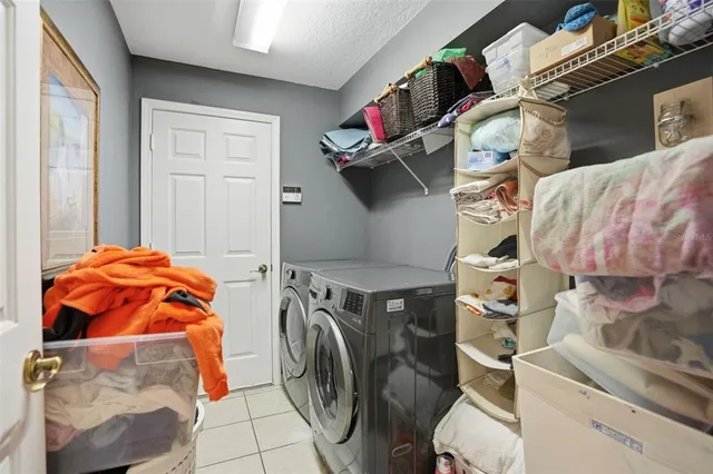 a bedroom with a bed and a fireplace