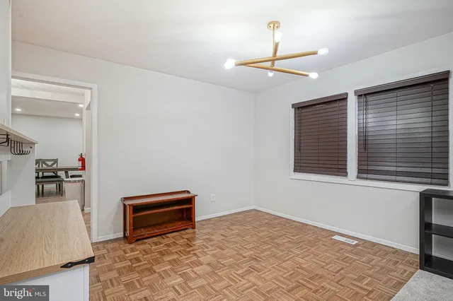 a kitchen with granite countertop a refrigerator and a sink