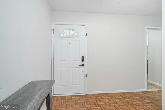 a bedroom with furniture and a fireplace