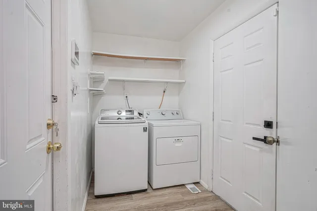a view of a house with wooden fence